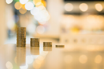 Coin and growth stacks with coins for finance and banking concept, selective focus, Planning to buy property. 