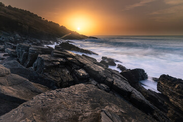 Sunset in the basque coast under Jaizkibel mountain in Hondarribia, Basque Country.