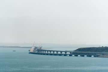 Crimean bridge against the background of the Kerch Bay in summer