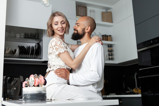 Loving couple hugging in the kitchen. Romantic, love concept. lifestyle photo