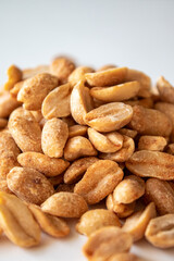 Roasted chili lemon peanuts on white background