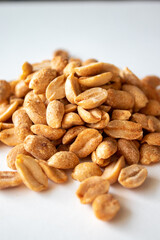 Roasted chili lemon peanuts on white background
