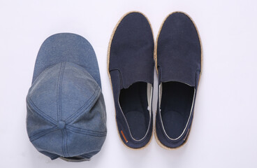 Cap and men's summer shoes on white background