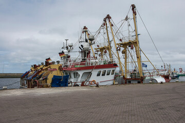 Naklejka premium fishing boats at the quai of the harbor of Lauwersoog 