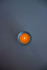 burning candle on the table. candle on the table. candle on gray background