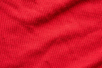 Red knitted wool texture background