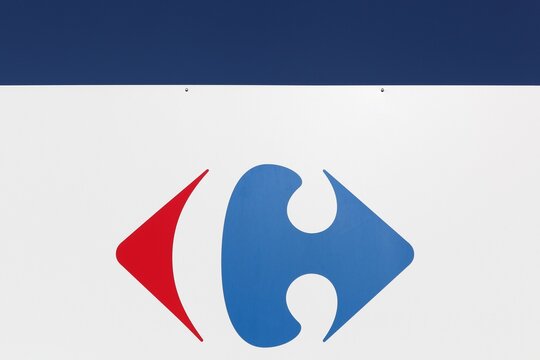 Macon, France - March 15, 2020: Carrefour sign on a panel. Carrefour is a french multinational retailer headquartered in France and it is one of the largest hypermarket chains in the world