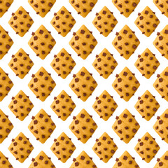 Cookies with pieces of dark chocolate on a white background. Seamless pattern for clothing design or printing paper packaging