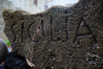 'Sicily' word engraved on a stone