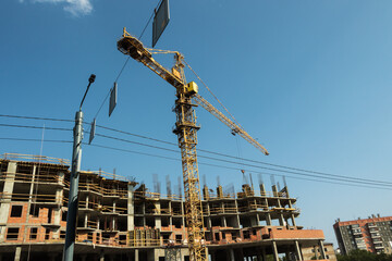 Crane and construction of a new house.