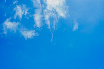 White clouds on beautiful clearly deep blue sky in a sunny day
