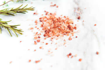 himalayan pink salt granules and rosemary herb, spice for cooking 
