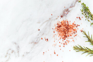 himalayan pink salt granules and rosemary herb, spice for cooking 