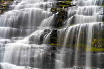 Fototapeta na wymiar Tvindefossen (Tvinnefossen, Trollafossen), a waterfall in Voss, Vestland county, Norway.