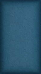 The surface of blue cardboard. Paper texture with cellulose fibers. Paperboard mobile phone wallpaper with vignetting. Vertical textured background with elegant dark azure tint. Macro