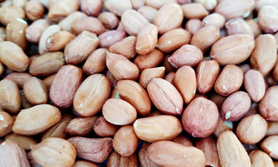 Obraz premium Red grain peanut on the entire background