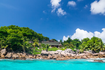 Beautiful hotel on the shore of the turquoise waters of the ocean. The Seychelles.
