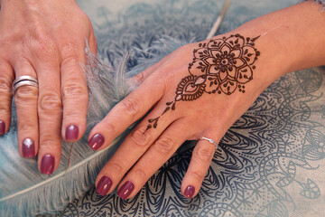 Mehendi tattoo. Woman Hands with henna tattoo