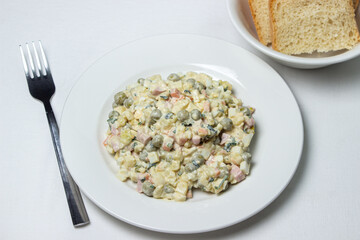 Vegetable salad on a white plate. Diet food. Healthy food portion