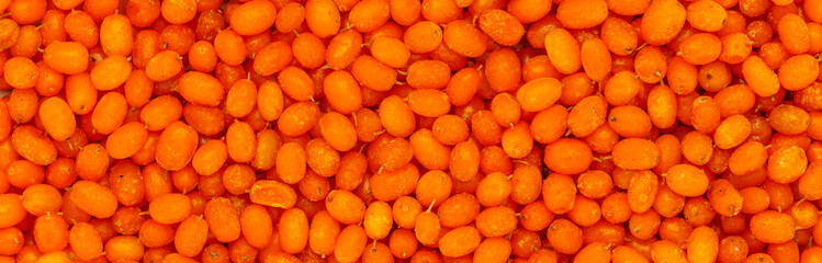 Sea buckthorn. Frozen berry. Culinary Background of ripe berries. A source of vitamins. The basis...