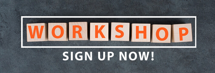 The word workshop is standing on wooden cubes, sign up now bottom