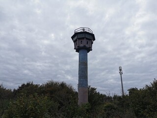 Old watchtower of the former German Democratic Republic at the coast of the baltic sea in Germany