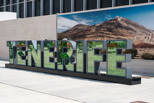 Tenerife, Spain - August, 2021: Tenerife Sign landmark with mount Teide poster background on Tenerife Airport South (TFS)