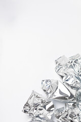 Crumpled foil trash on white background