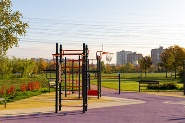 sports complex, horizontal bars in a city park on a sunny morning in the autumn. Urban recreation infrastructure. Outdoor sport training facilities in fresh air