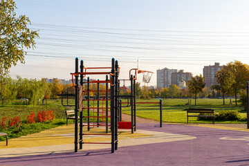 sports complex, horizontal bars in a city park on a sunny morning in the autumn. Urban recreation...