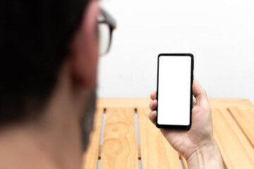 Person looking at smartphone in vertical position