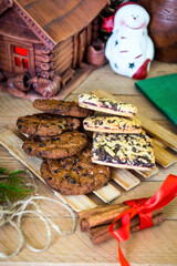Lots of different homemade cookies with Christmas decorations around