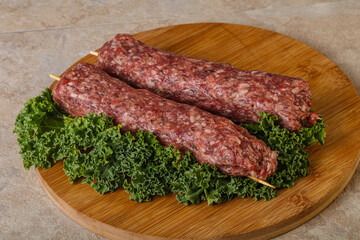 Raw minced beef kebab skewer