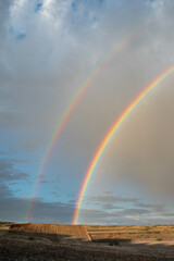 Fototapeta na wymiar double rainbow after storm