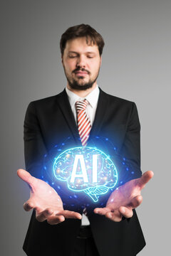 businessman with a virtual brain symbol and the message AI floating over his hand in front of neutral grey background