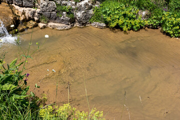Mountain rivers, sources of ecologically clean resources of water reserves on the planet, a sunny summer day.