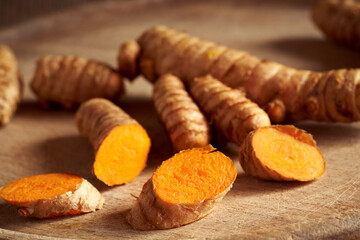 Sliced fresh curcuma or turmeric root, close up