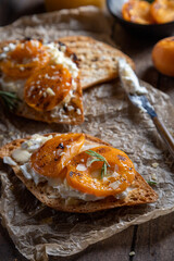 Bruschetta with goat cheese, fried apricots and rosemary, rustic style 