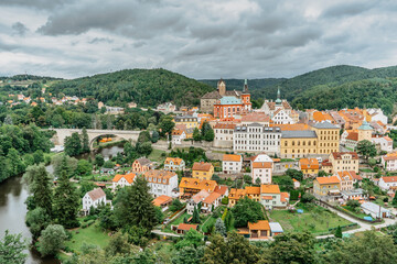 Obraz premium Panoramic view of famous medieval town of Loket,Elbogen, with colorful houses and stone castle above river,Czech Republic.Historical city centre is national monument.Travel architecture background
