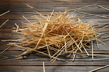 Heap of dried hay on wooden background