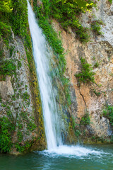 Fototapeta na wymiar Beautiful waterfall at Drafi in Penteli mountain near Athens, Greece.