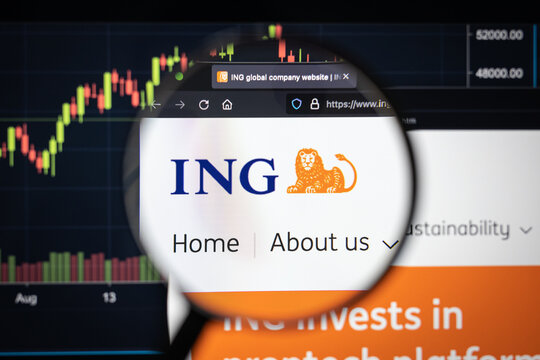 ING-DiBa AG company logo on a website with blurry stock market developments in the background, seen on a computer screen through a magnifying glass
