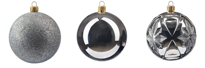three different silver-colored Christmas tree toys on a white isolated background.