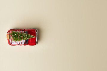Little red toy car and Christmas tree