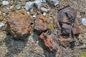 Iron ore lying on the surface of the earth close-up.