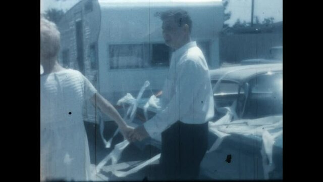 Honeymoon Starts, 1966 - A couple leaves their wedding to find their trailer and car festooned. 