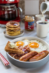 American bacon, eggs, pancakes and toast breakfast. Traditional American breakfast .