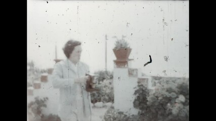 Oceanside Photography 1958 - A woman takes pictures at the oceaside in Baja California, 1958. 