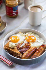 American bacon, eggs, pancakes and toast breakfast. Traditional American breakfast .