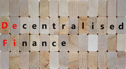 DeFi, Decentralised finance symbol. Concept words 'DeFi, Decentralised finance' on wooden blocks. Beautiful wooden background, copy space. Business and DeFi, decentralised finance concept.